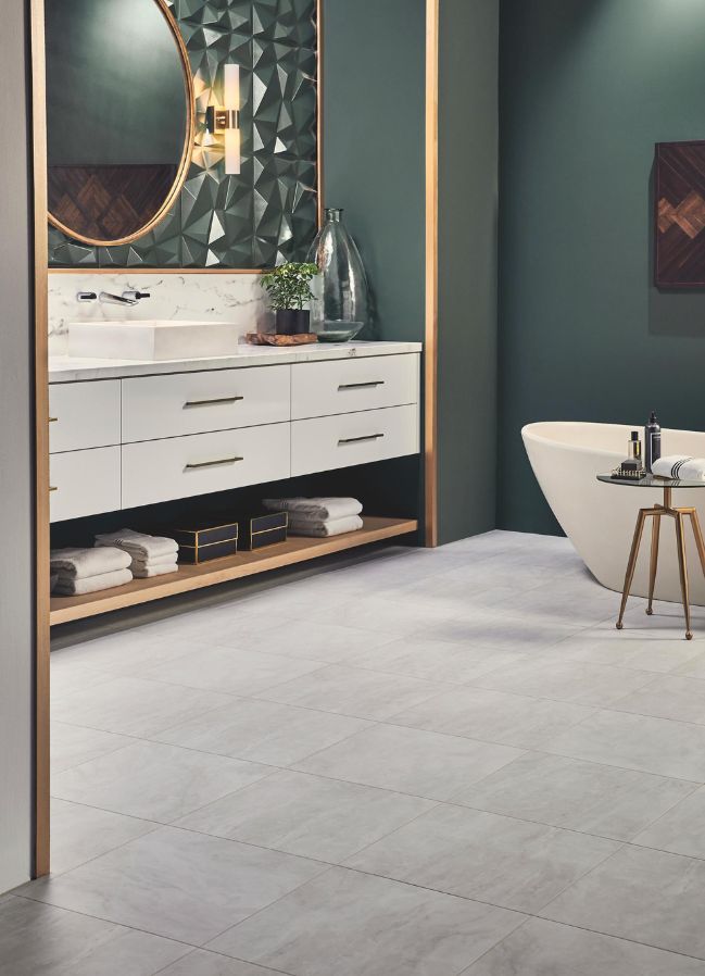 grey luxury vinyl tile flooring in an elegant green bathroom